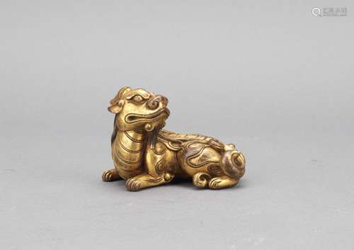 A gilt bronze cast seated luduan