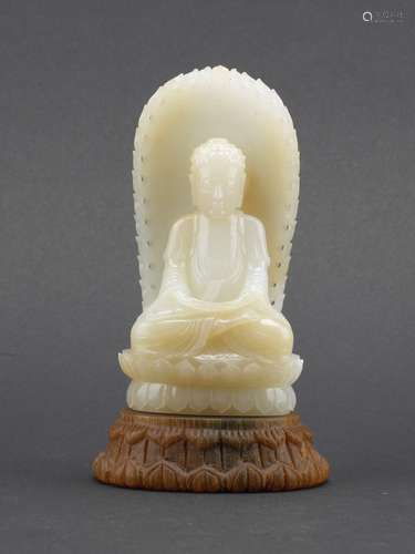 A white jade carved Amitabha figure with stand