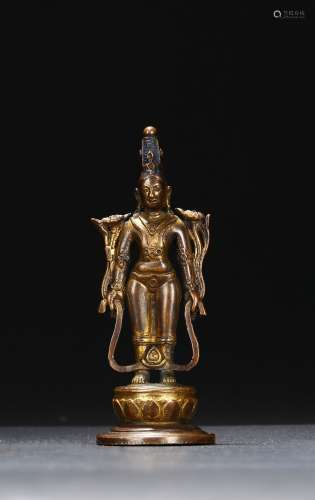 A gilt copper figure of standing bodhisattva