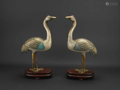 A pair of cloisonne enamel cranes with stand