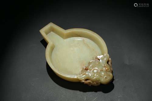 A Chinese yellow jade 'mythical beast' washer