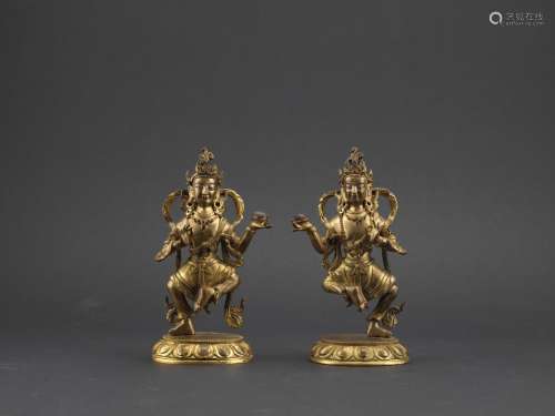 A pair of Tibetan gilt bronze deities