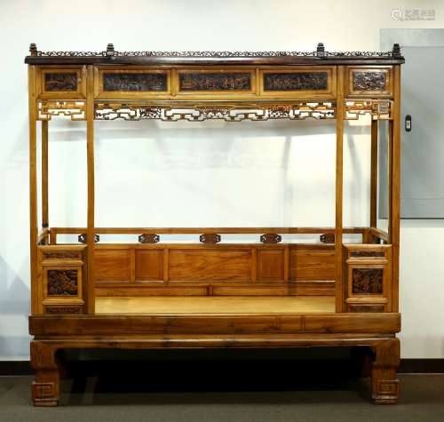 A Huangyangmu carved six post canopy bed