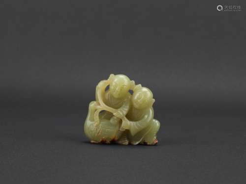 A yellow jade carving of boys and goose