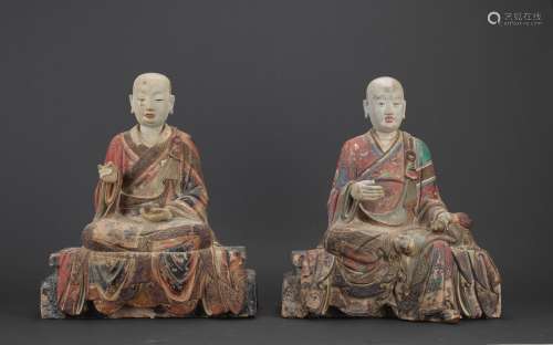 A pair of large polychrome clay arhat figures