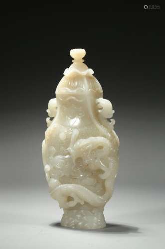 A finely carved white jade 'dragon' vase and cover