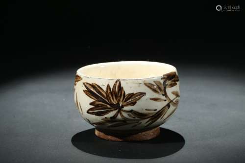 A white glazed painted bowl