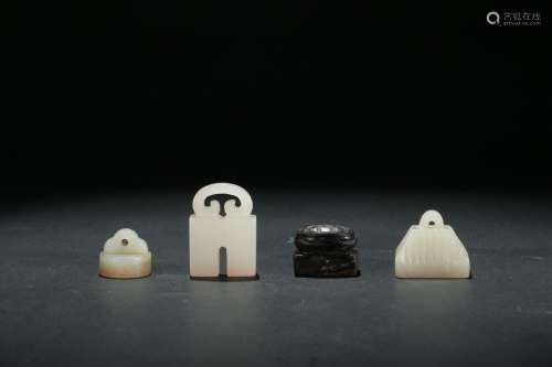 A group of four carved jade seals