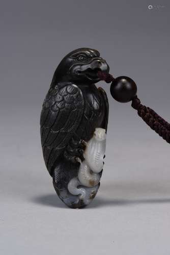 A black and white jade carved pendant