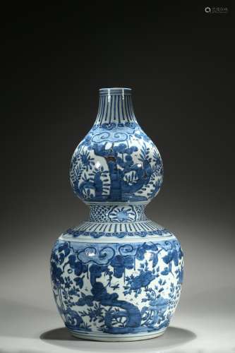 A large blue and white double gourd vase