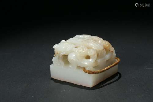 A white jade carved 'chilong' seal