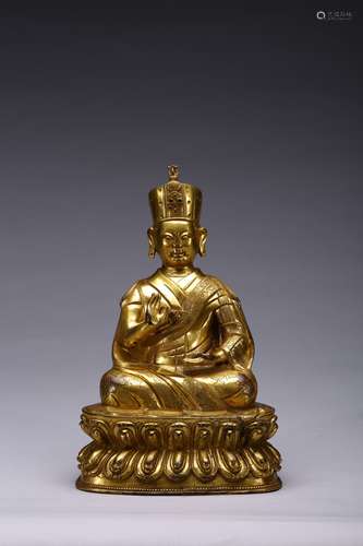 A gilt bronze figure of lama