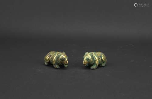 A pair of gold inlaid bronze bears