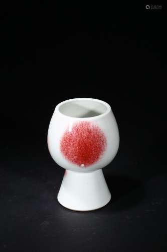 A red glazed wine cup