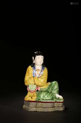 A sancai stoneware figure of seated guanyin