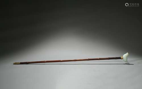 A Chinese bamboo stick with white jade bird ornament