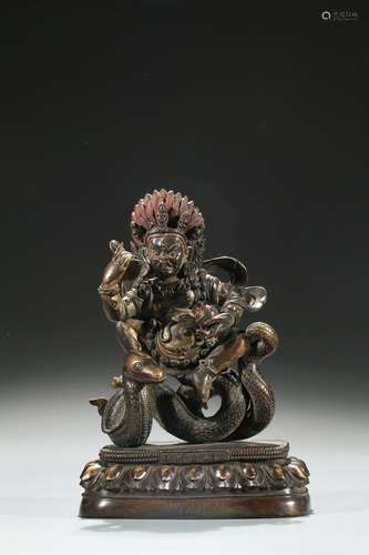 A cold gilded figure of buddhist deity