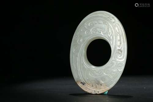 A jade carved 'phoenix' oval disc