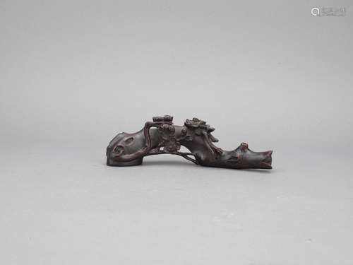 An agarwood carved plum blossom branch brushrest