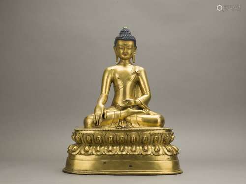 A gilt bronze figure of seated shakyamuni