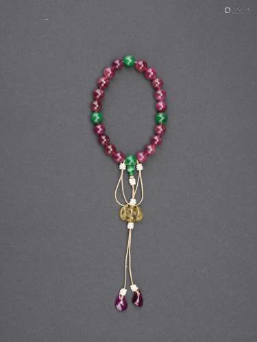 A pink tourmaline and jadeite bead rosary bracelet