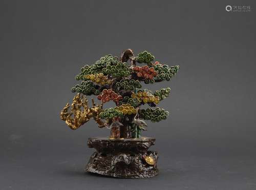 A painted bronze model of crane and pine tree