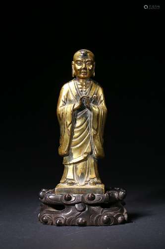 A Chinese gilt bronze figure of standing Ananda