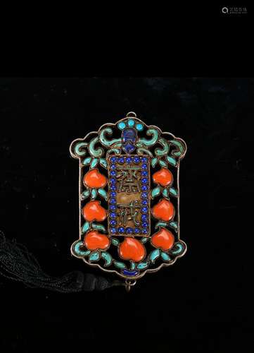 A silver filigree and turquoise coral inlaid 'jie' pendant