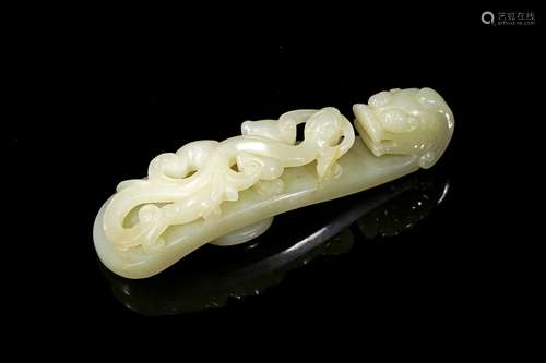 A Chinese white jade carved belt hook