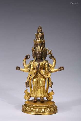 A gilt-bronze figure of standing eleven-faced bodhisattva