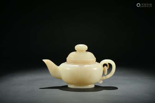 A white jade carved teapot and cover