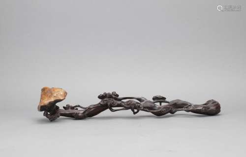 A naturalistic zitan carved ruyi scepter