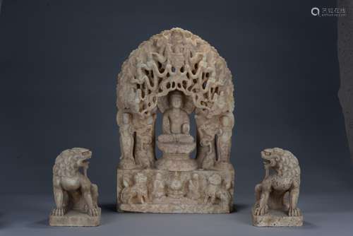 A large marble carved bodhisattva and two buddhist lions