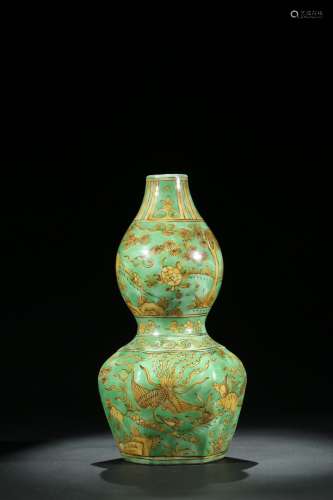 A Chinese green and yellow glazed double gourd vase