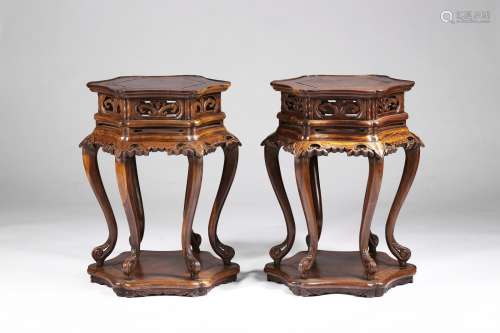 A pair of hardwood carved table-form stands