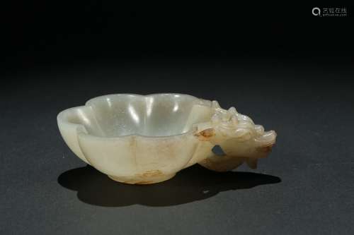 A white jade lobed 'dragon' washer