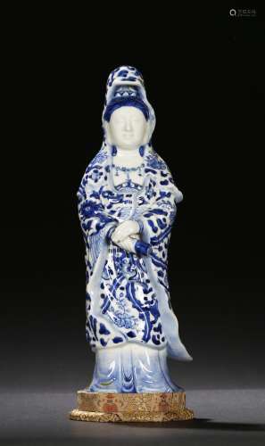 A blue and white figure of standing guanyin