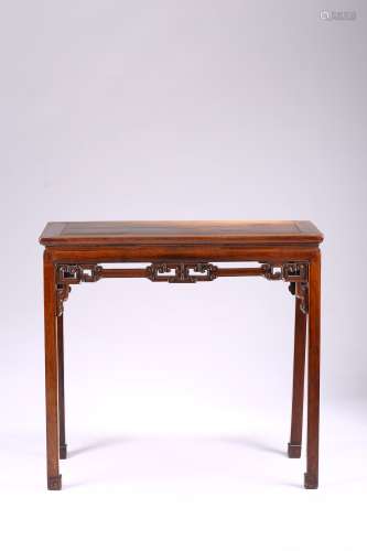 A hardwood carved corner leg side table