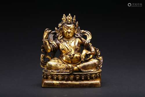A gilt-bronze figure of Jambhala