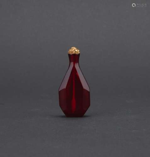 A ruby red glass faceted snuff bottle