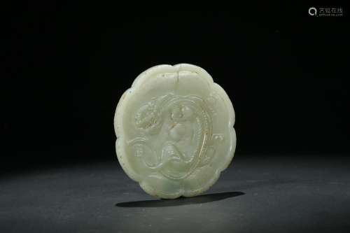 A white jade carving of lobed 'chilong' mirror