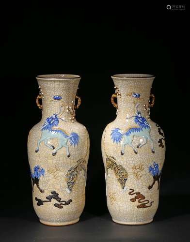 A pair of crackled moulded 'mythical beast' vases