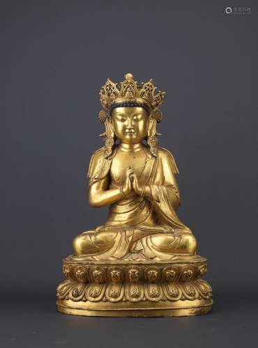 A large gilt bronze figure of Vairocana