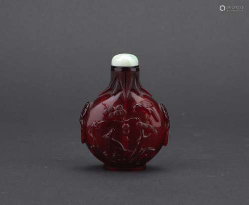 A ruby red glass 'eagle and bear' snuff bottle