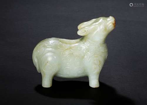 A white jade archaistic tapir-form vessel