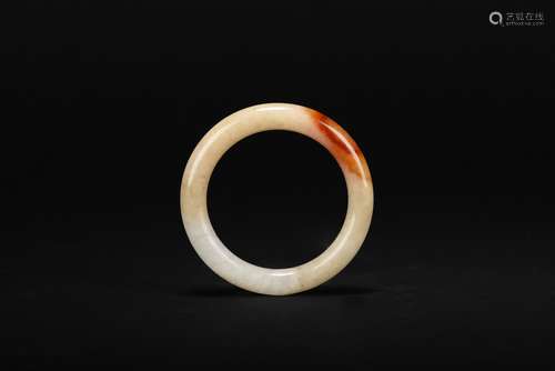 A carnelian jade bangle