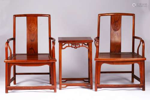 A pair of hardwood armchairs and stand