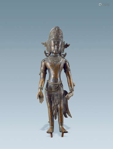 A copper alloy figure of standing deity
