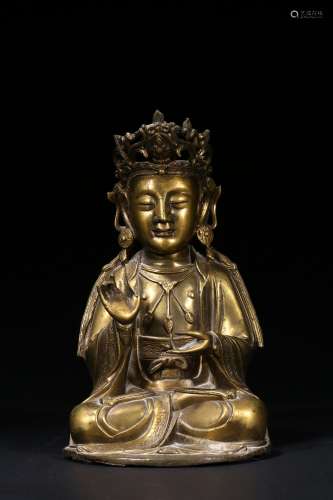 A gilt bronze figure of seated bodhisattva