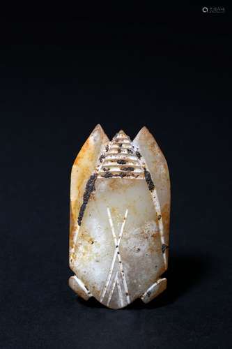 An archaic white and russet jade cicada